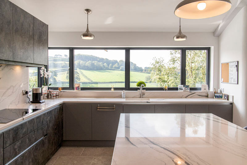 The kitchen features a sleek modern interior