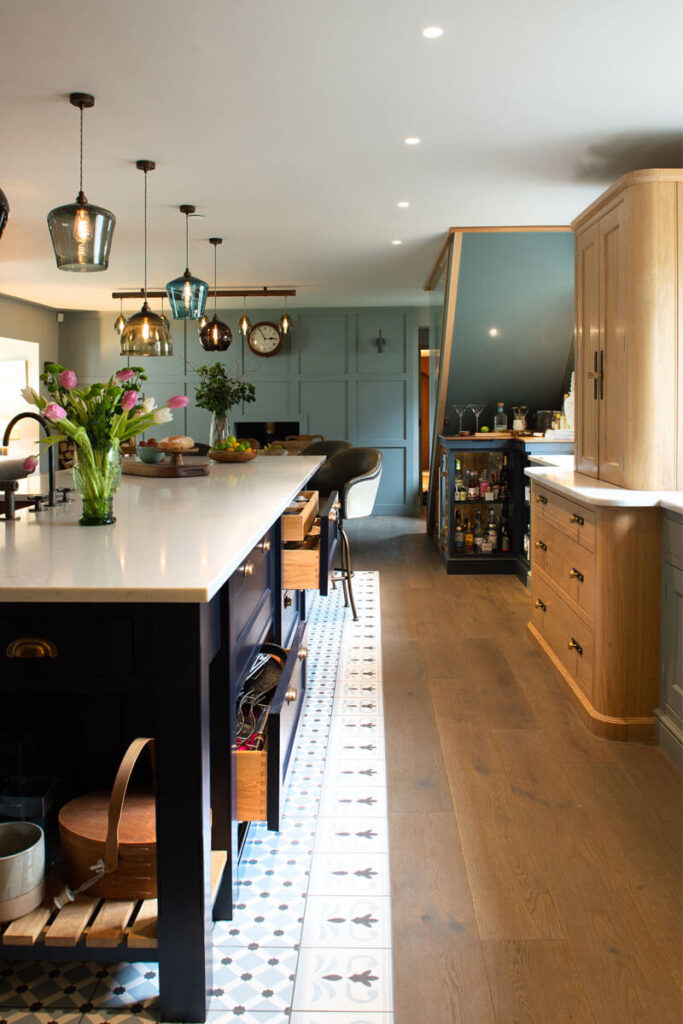 A great example of a two tone sage green and navy kitchen